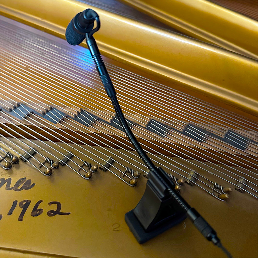 Piano instrument microphones from Acacia Audio with specialized magnetic mounts and flexible goosenecks, designed for precise stereo recording on acoustic instruments.